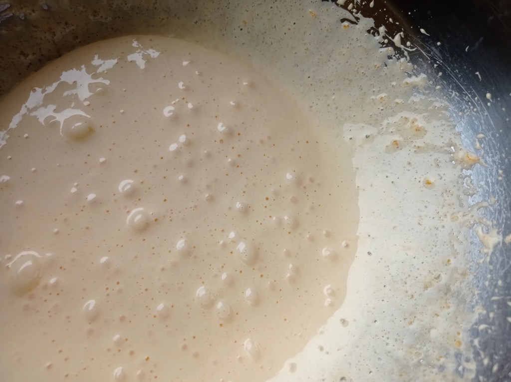 Foamy, pale-yellow mixture of egg yolks and sugar whipped to a thick consistency in a mixing bowl